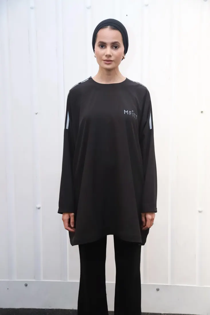 Before: Model wearing the MFITT black oversized top